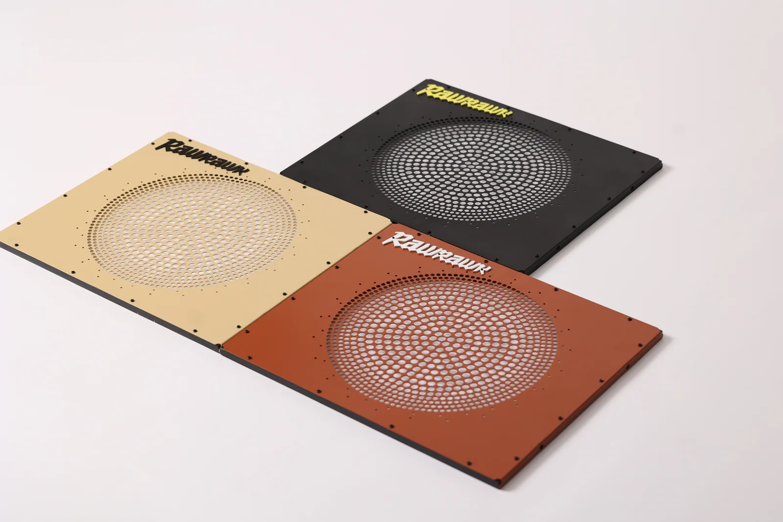 Loose Quasar Airframes lying diagonally in a studio, with Corten in the foreground and Dune and Obsidian behind